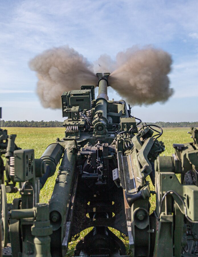 U.S. Marines with 2d Battalion, 10th Marine Regiment, 2d Marine Division, fire a M777 Howitzer during an artillery raid as part of Exercise Rolling Thunder 21.2 at Camp Lejeune, N.C., April 28, 2021.