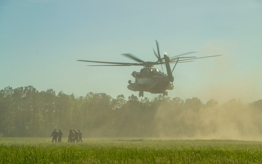 A U.S. Marine Corps CH-53E Super Stallion with Marine Heavy Helicopter Squadron 464, 2nd Marine Aircraft Wing, transports Marines during an artillery raid as part of Exercise Rolling Thunder 21.2 at Camp Lejeune, N.C., April 28, 2021.