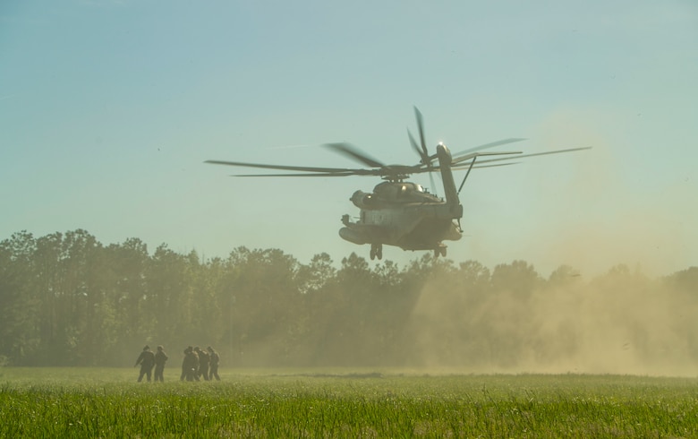 A U.S. Marine Corps CH-53E Super Stallion with Marine Heavy Helicopter Squadron 464, 2nd Marine Aircraft Wing, transports Marines during an artillery raid as part of Exercise Rolling Thunder 21.2 at Camp Lejeune, N.C., April 28, 2021. This exercise is a 10th Marine Regiment-led live-fire artillery event that tests 10th Marines' abilities to operate in a simulated littoral environment against a peer threat in a dynamic and multi-domain scenario. (U.S. Marine Corps photo by Staff Sgt. Akeel Austin)