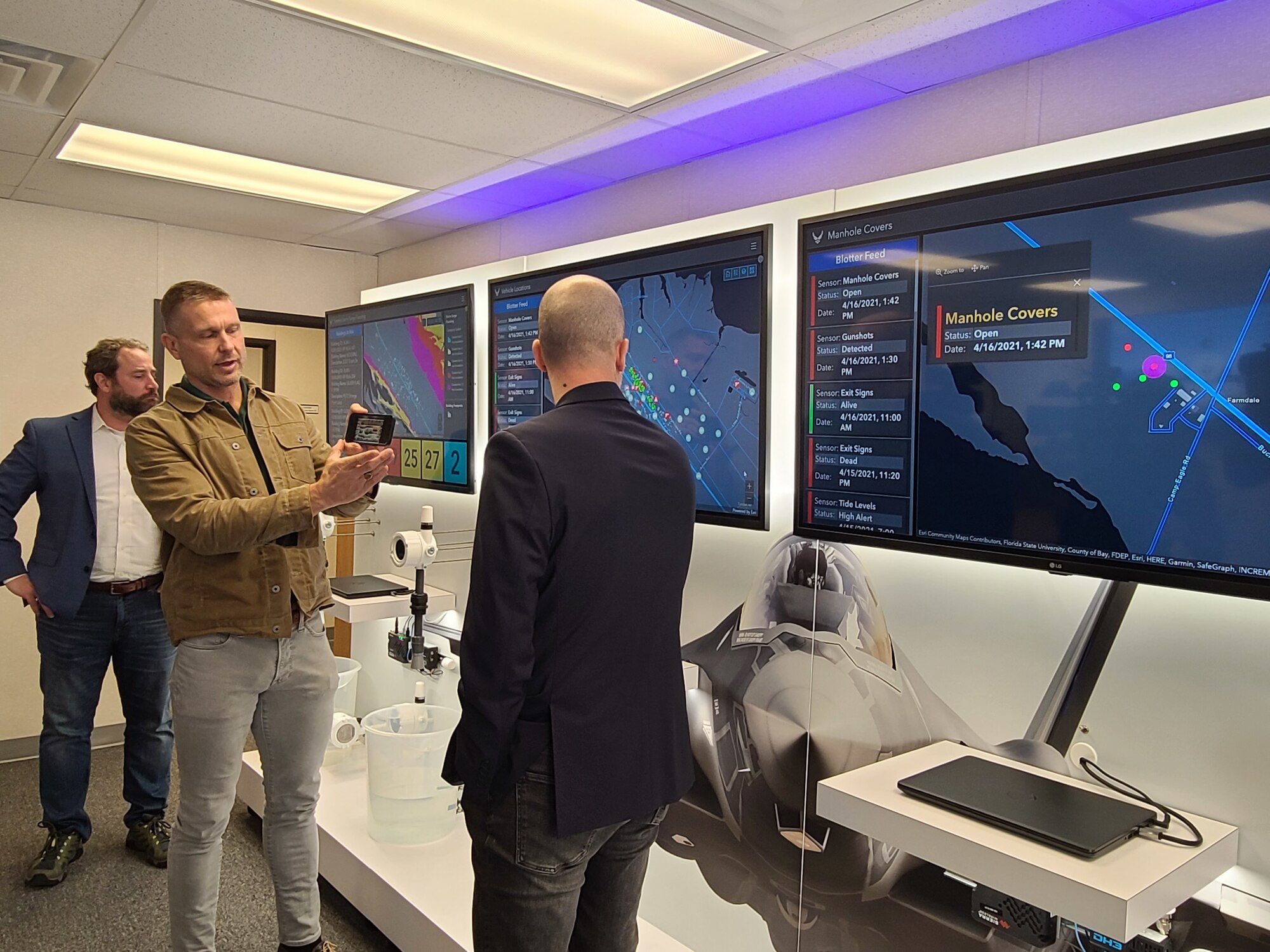 Lowell Usrey, Tyndall’s PMO Integration branch chief, simulates receiving gunshot notification from the Installation Resilience Operations Center prototype during a hands-on equipment demonstration at Tyndall, April 28, 2021. (U.S. Air Force photo by Sarah McNair)