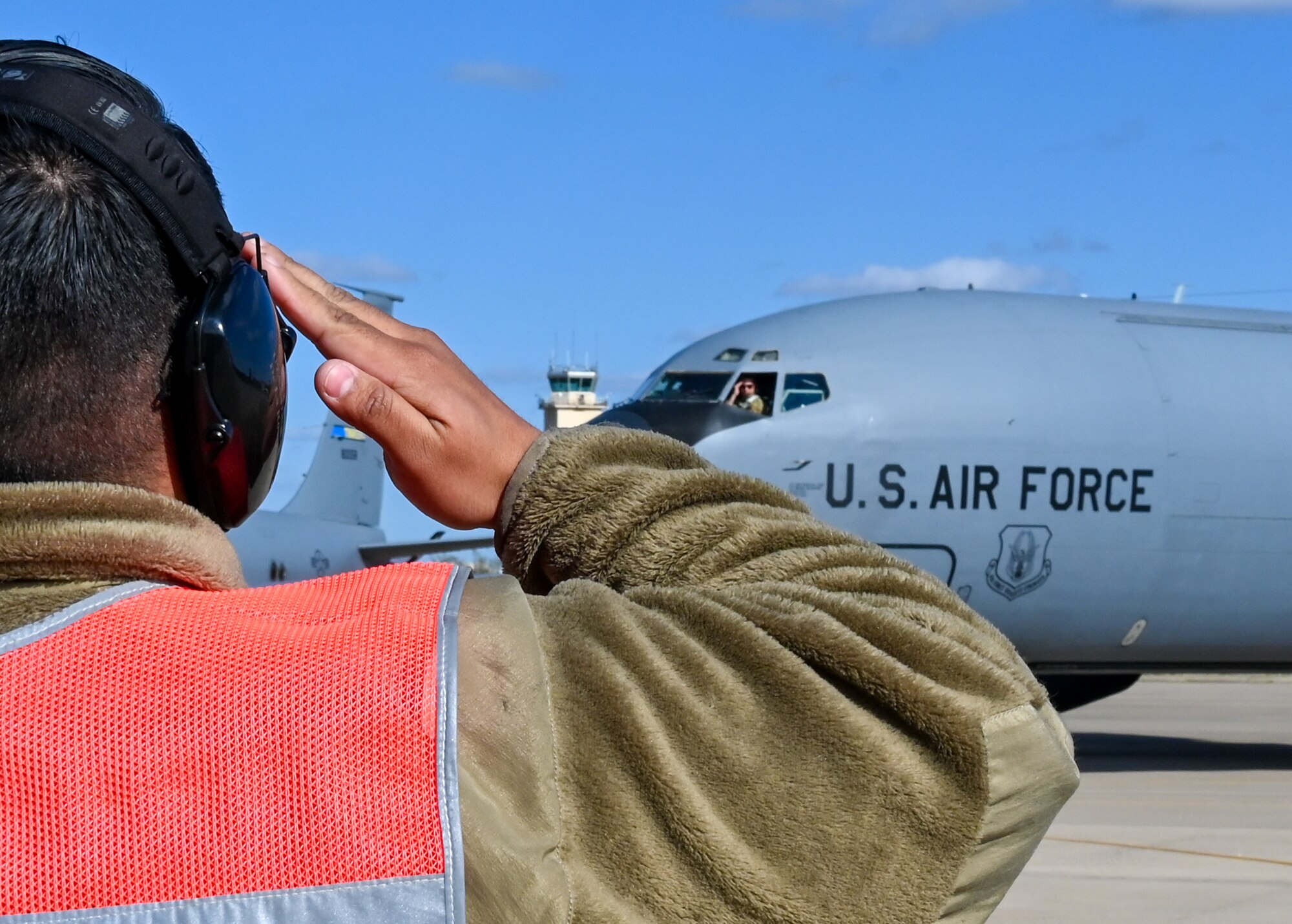 A crew chief from the 507th Aircraft Maintenance Squadron marshals a KC-135R Stratotanker April 7, 2021, at Tinker Air Force Base, Oklahoma. (U.S. Air Force photo by Senior Airman Mary Begy)