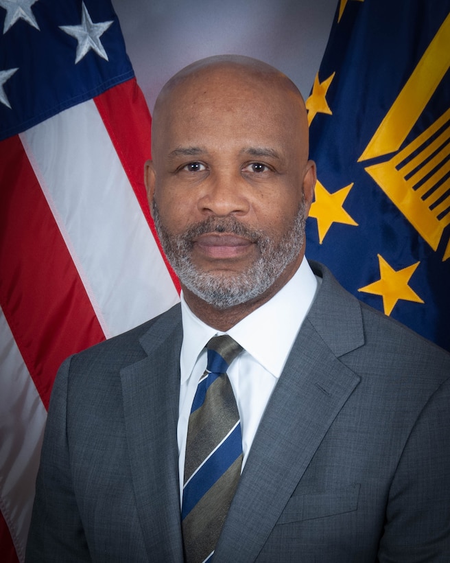 Deputy Commander DLA Energy, W. Eric Smith, portrait in front of a U.S. flag