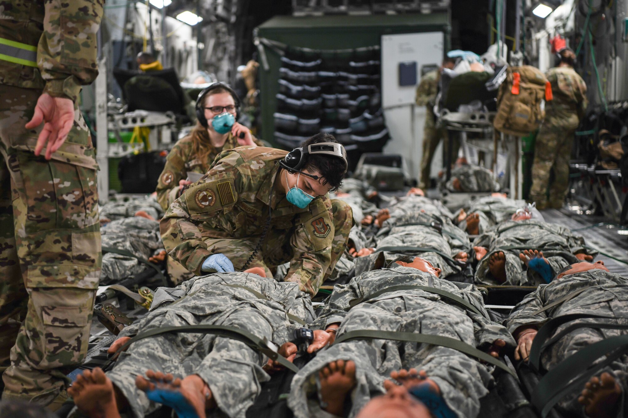 Senior Airman Dominic Slonosky, 445th Aeromedical Evacuation Squadron, checks the vitals of patients on a 445th Airlift Wing C-17 Globemaster III during the Ultimate Caduceus training exercise April 29, 2021. U.S. Transportation Command (USTRANSCOM) began a week-long aeromedical and global patient movement exercise, Ultimate Caduceus, April 26. Approximately 250 personnel including members of the 445th Airlift Wing and the 88th Air Base Wing participated in the field training exercise. (U.S. Air Force photo//Master Sgt. Patrick O’Reilly)