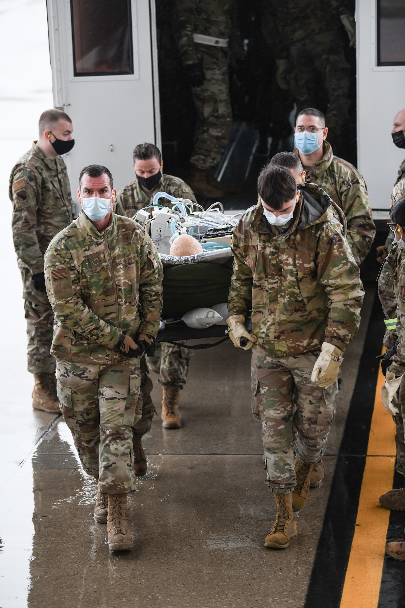 Medical personnel from Wright-Patterson Air Force Base, Ohio, transport “patients” onto a 445th Airlift Wing C-17 Globemaster III during the Ultimate Caduceus training exercise April 29, 2021.   U.S. Transportation Command (USTRANSCOM) began a week-long aeromedical and global patient movement exercise, Ultimate Caduceus, April 26. Approximately 250 personnel including members of the 445th Airlift Wing and the 88th Air Base Wing participated in the field training exercise. (U.S. Air Force photo//Master Sgt. Patrick O’Reilly)