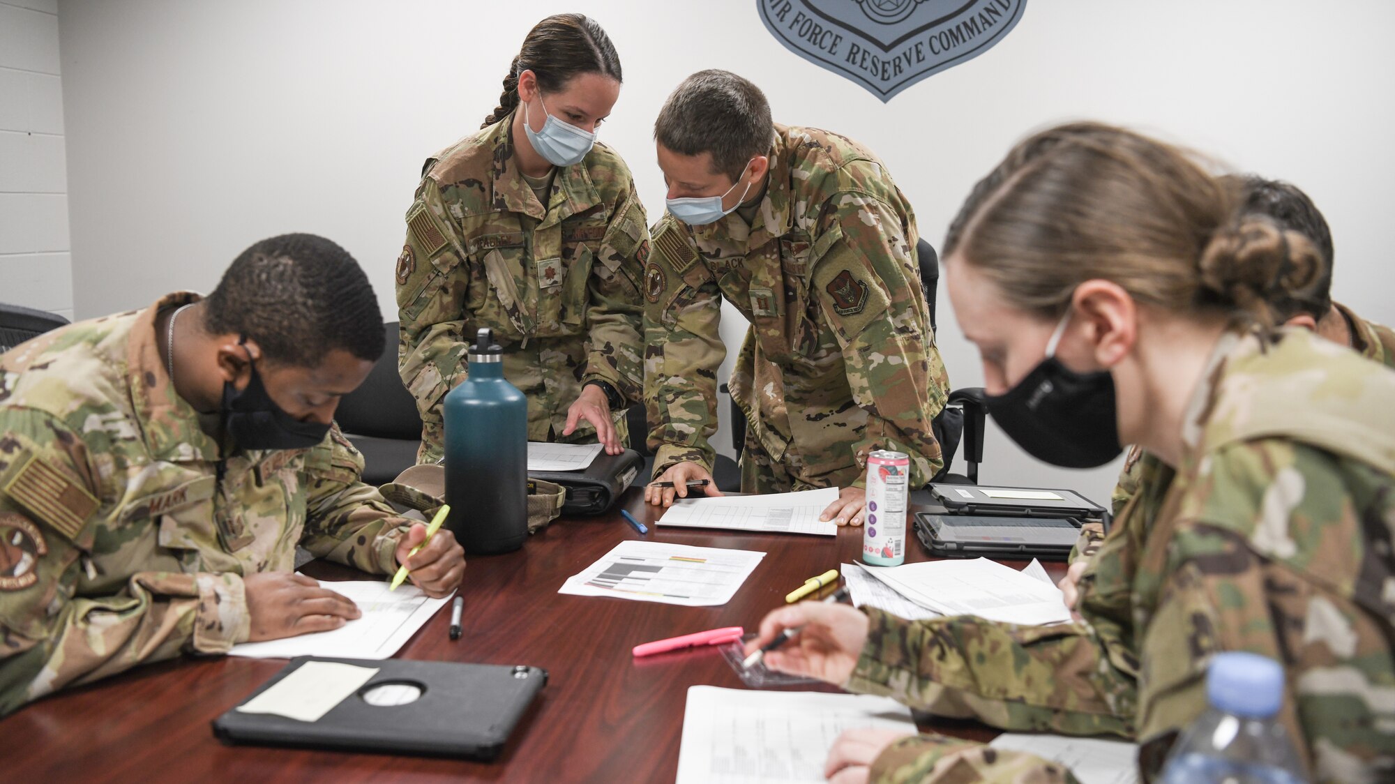 Reserve Citizen Airmen from the 445th Aeromedical Evacuation Squadron brief before a flight during the Ultimate Caduceus training exercise April 30, 2021.  U.S. Transportation Command (USTRANSCOM) began a week-long aeromedical and global patient movement exercise, Ultimate Caduceus, April 26. Approximately 250 personnel including members of the 445th Airlift Wing and the 88th Air Base Wing participated in the field training exercise. (U.S. Air Force photo//Master Sgt. Patrick O’Reilly)