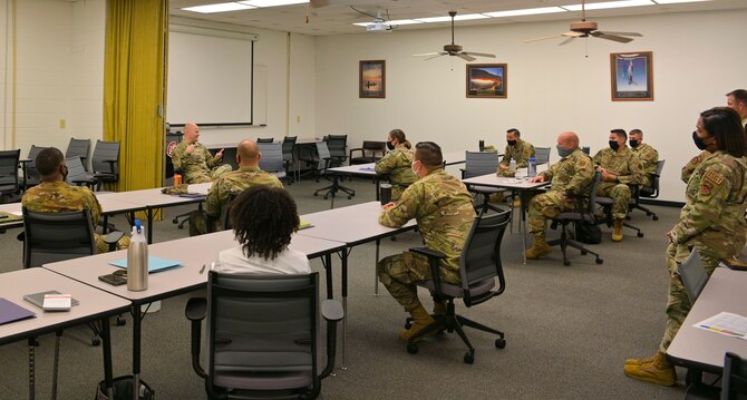 U.S. Air Force Chief Master Sgt. Trevor James, 14th Flying Training Wing command chief, talks to attendees at the First Sergeant symposium, Apr. 29, 2021, on Columbus Air Force Base, Miss. According to AFI36-2113, First sergeants are a dedicated focal point for all readiness, health, morale, welfare and quality of life issues within their organizations. (U.S. Air Force photo by Airman 1st Class Jessica Haynie)