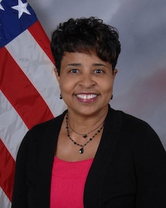 Janice Samuel, Director, DLA EEO portrait in front of a U.S. flag