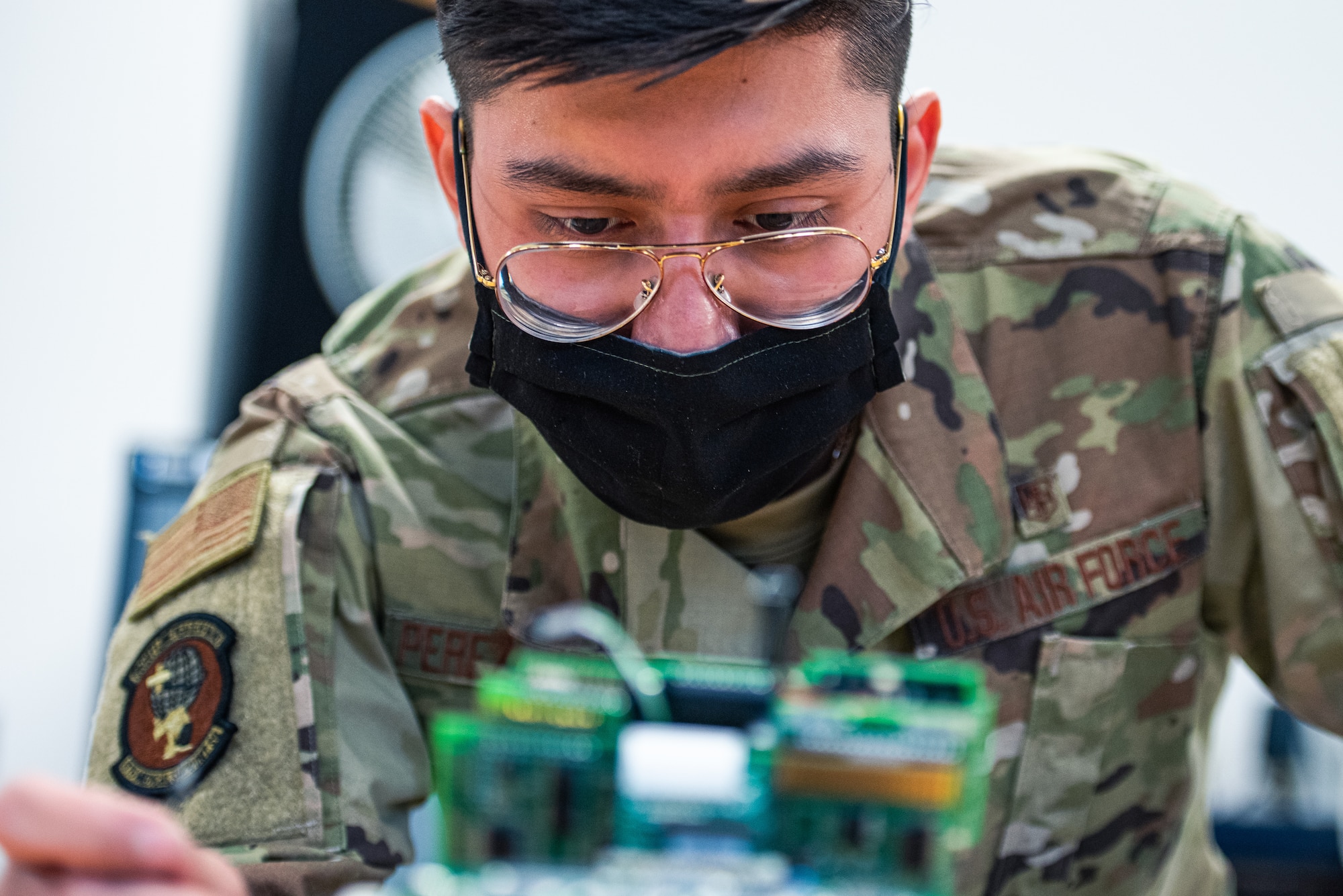 U.S. Air Force Airman 1st Class Eric Perez-Solano, 375th Medical Support Squadron biomedical equipment technician, repairs a piece of medical equipment at Scott Air Force Base, Illinois, April 23, 2021. Airmen at the Medical Equipment Repair Center repair lifesaving equipment at Scott AFB and other regions. (U.S. Air Force photo by Airman 1st Class Isaac Olivera)