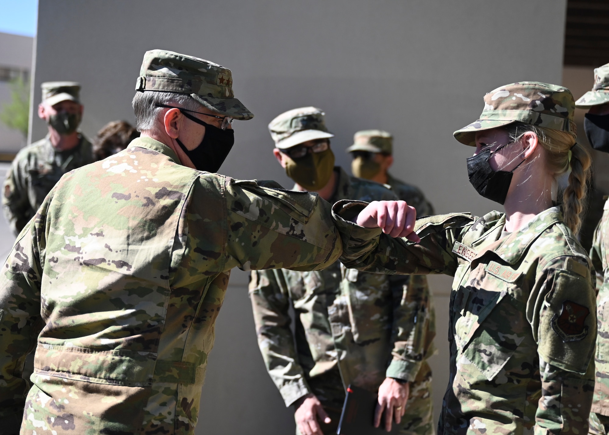 U.S. Air Force Gen. Tim Ray, Air Force Global Strike Command commander, left, greets an Airman.