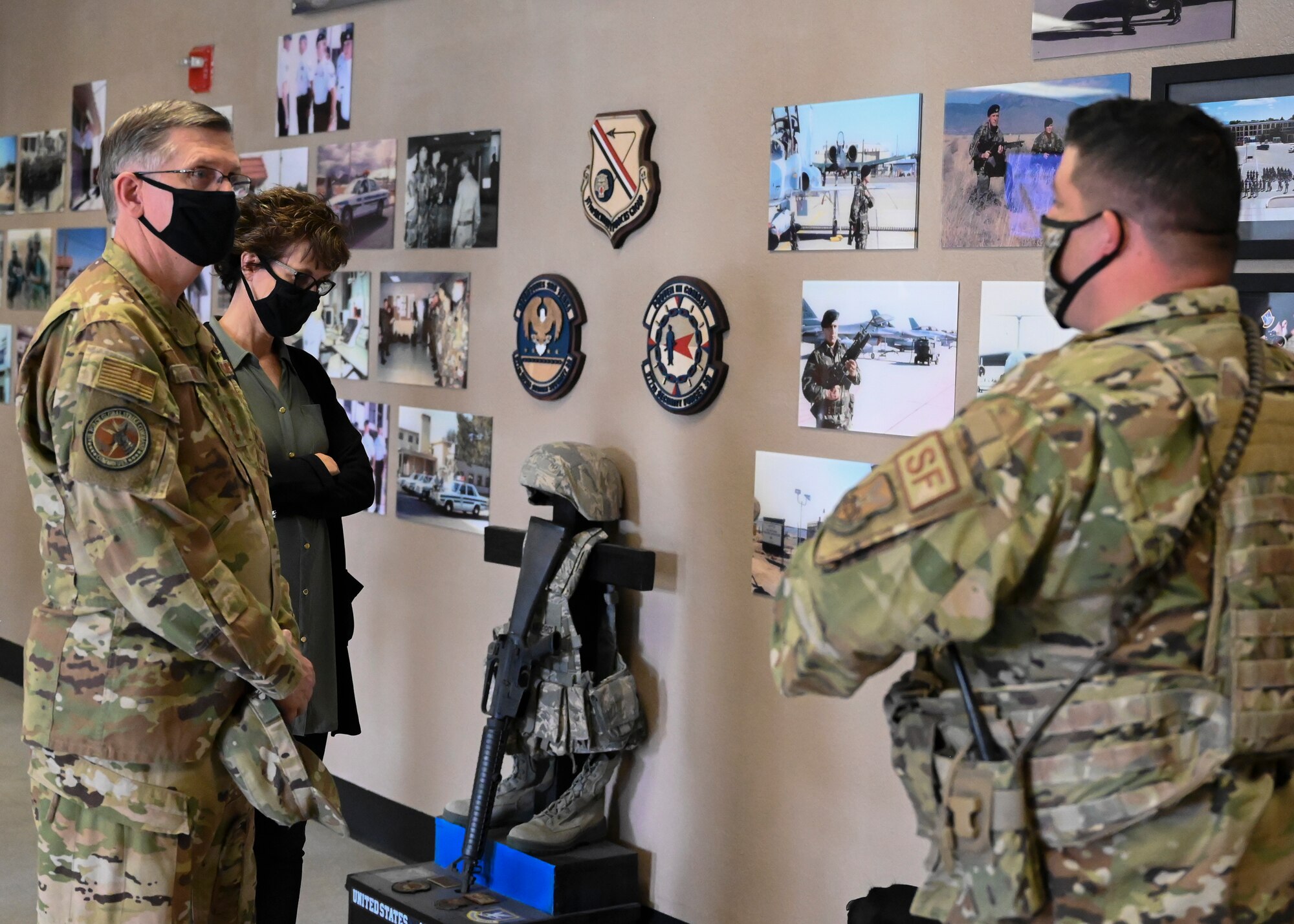 U.S. Air Force Gen. Tim Ray, Air Force Global Strike Command commander, and his spouse, Rhonda, learn about the newly renovated 377th Security Forces Group Heritage Room.