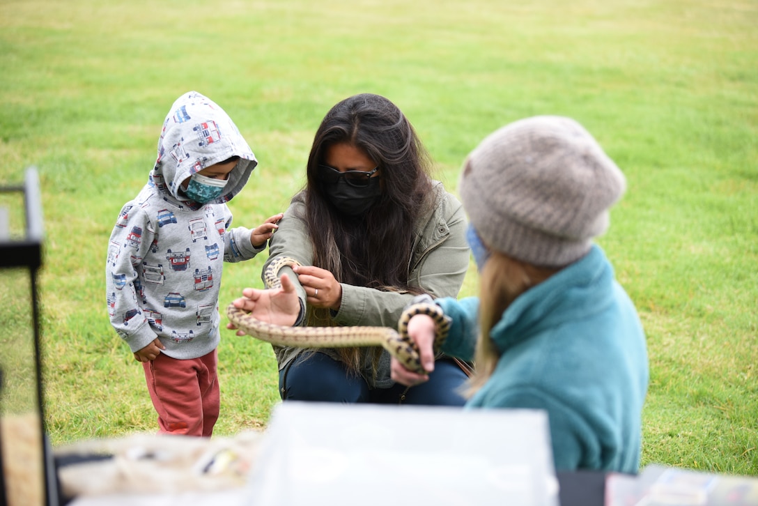 California Polytechnic State University’s herpetological group teaches visitors about their reptiles during an Earth Day event April 21, 2021, at Vandenberg Air Force Base, Calif. The event featured a raffle, a rock wall, food trucks and vendors from earth related agencies across the local area. (U.S. Space Force photo by Senior Airman Hanah Abercrombie)