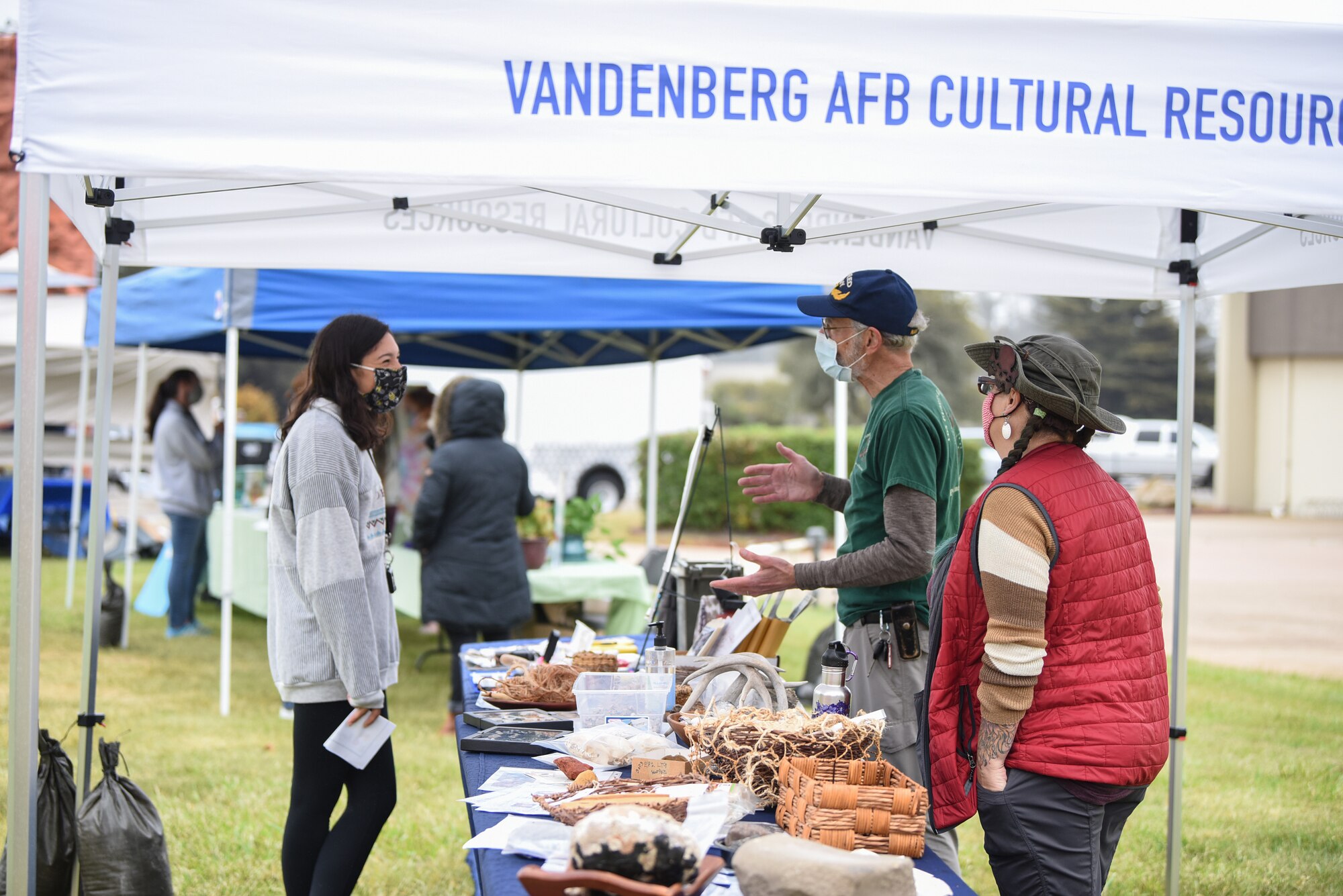 Visitors learn about Earth Works cultural resources during an Earth Day event on April 21, 2021, at Vandenberg Air Force Base, Calif.  The Earth Day event also featured a raffle, a rock wall, food trucks, and vendors from local area earth-related agencies.  (U.S. Space Force photo by Senior Airman Hanah Abercrombie)