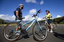 Bicyclists prepare to take part in the Mokapu Cultural Sites Bike Tour, Marine Corps Base Hawaii, April 23, 2021. MCBH Cultural Resource Managers, June Cleghorn and Arleen Garcia-Herbst, led a tour while informing participants of the protected cultural sites and historic significance of the MCBH Mokapu Peninsula. (U.S. Marine Corps photo by Lance Cpl. Samantha Sanchez)