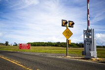 Signs are displayed warning drivers of aircraft activity on the flightline, Marine Corps Air Station Kaneohe Bay, Marine Corps Base Hawaii, April 28, 2021. MCAS Kaneohe Bay's flightline security measures are expected to increase throughout 2021. (U.S. Marine Corps photo by Lance Cpl. Brandon Aultman)