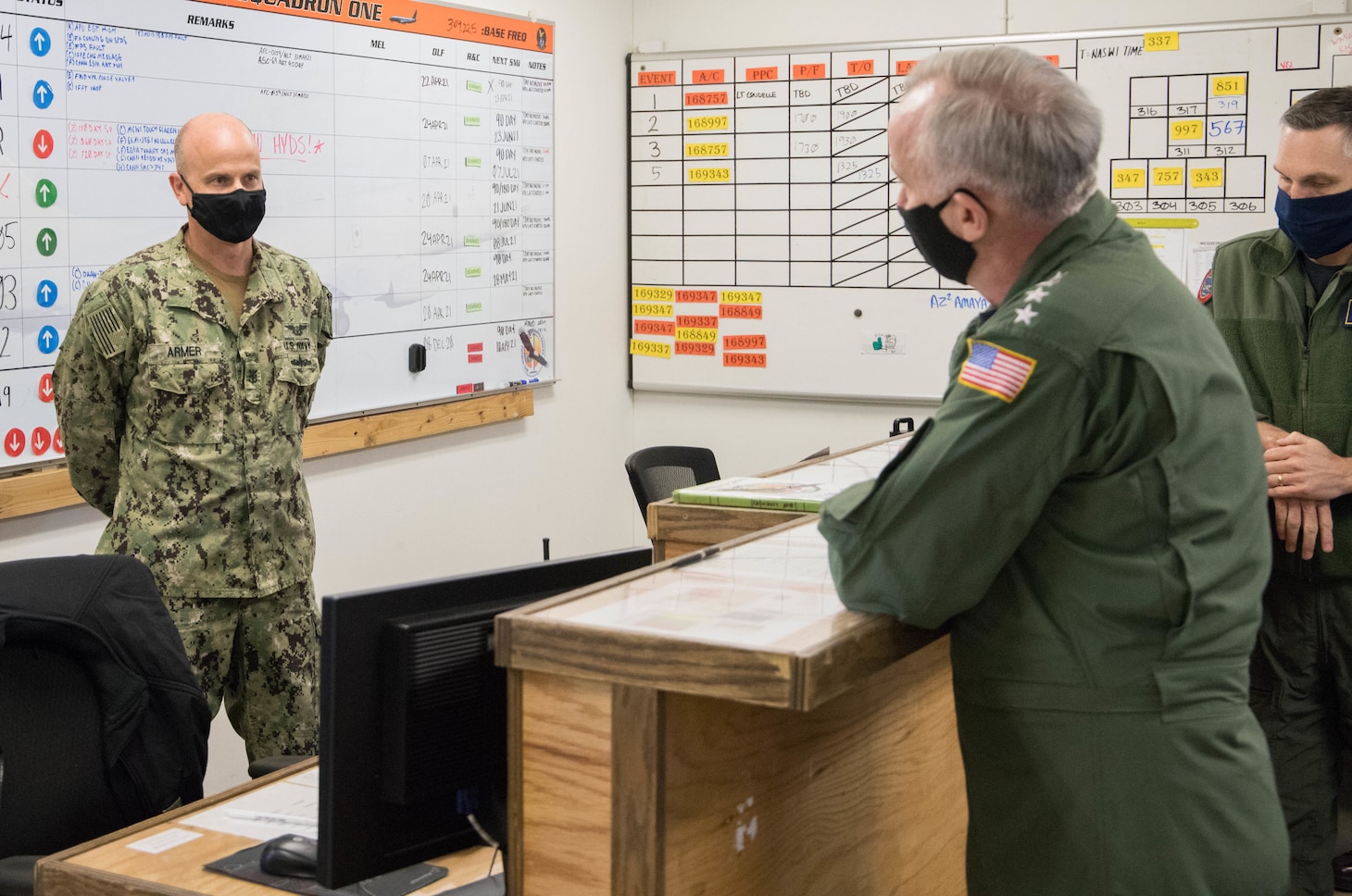Admiral Bill Lescher, Vice Chief of Naval Operations, speaks with maintainers from Patrol Squadron (VP) 1 at Naval Air Station (NAS) Whidbey Island about their participation in the Maintenance Operation Center (MOC) Aircraft-on-Ground (AOG) Cell April 26, 2021.