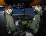Vice Chief of Naval Operations (VCNO), Adm. Bill Lescher, right, participates in a tactical operational flight training simulation with Lt. Zach Roecker, a Weapons and Tactics instructor assigned to the “Seahawks” of Helicopter Maritime Strike Squadron (HSM) 41.
