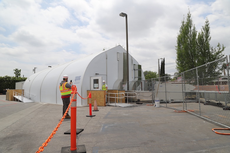 Michael Curtis, a COVID 19 response  mission support specialist from the U.S. Army Corps of Engineers Los Angeles District looks over the work at ACF#2 at Mission Community Hospital, in Panorama City, California, April 22, as part of FEMA’s support to California in response to the COVID-19 pandemic.