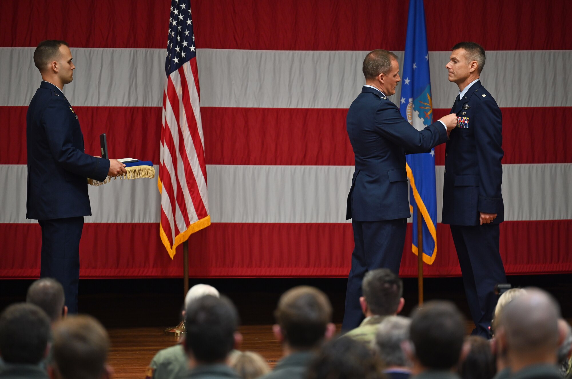 Col. Justin Spears, 14th Operations Group commander, pins on the meritorious service medal, 3rd oak leaf cluster, on Lt. Col. Nathaniel Wilds, former 50th Flying Training Squadron commander, for his service, April 30, 2021, on Columbus Air Force Base, Miss. Wilds served as commander of the 50th FTS from April 2019-April 2021. (U.S. Air Force photo by Senior Airman Jake Jacobsen)