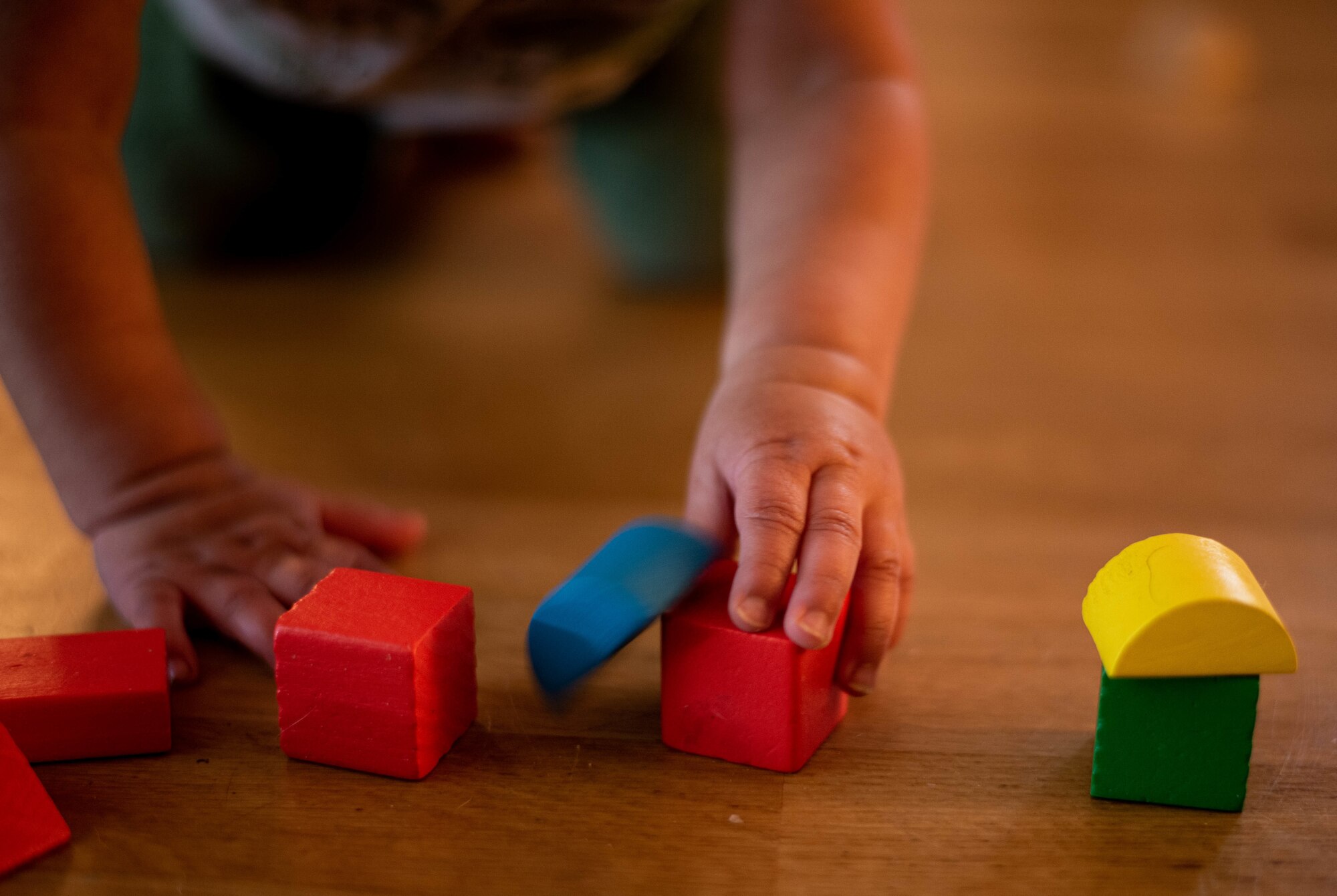 toddler plays with blocks