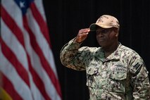 210729-N-IG466-0021 NAVAL SUPPORT ACTIVITY BAHRAIN (July 29, 2021) – Capt. Robert C. Francis, incoming commander of Destroyer Squadron (DESRON) 50 and Task Force (TF) 55, salutes the flag during a change of command ceremony presided over by Vice Adm. Brad Cooper, commander, U.S. Naval Forces Central Command, U.S. 5th Fleet and Combined Maritime Forces, onboard Naval Support Activity Bahrain, July 29. DESRON 50 and TF 55 operate in the U.S. 5th Fleet area of operations in support of naval operations to ensure maritime stability and security in the Central Region, connecting the Mediterranean and Pacific through the western Indian Ocean and three critical chokepoints to the free flow of global commerce. (U.S. Navy photo by Mass Communication Specialist 2nd Class Adelola Tinubu)