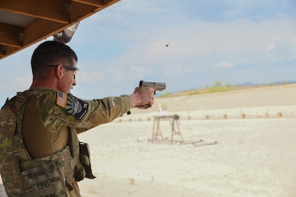Spc. Adam Barlow, from the 65th Field Artillery Brigade, Utah National Guard, competes in the three-gun challenge event July 20, 2021, during the U.S. Army National Guard Best Warrior Competition at Florence Military Reservation, Arizona.