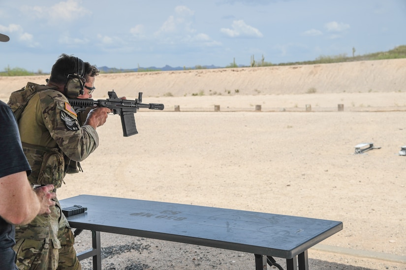 A staff sergeant (name withheld for security) from the 19th Special Forces Group (Airborne) competes in the three-gun challenge event July 20, 2021, during the U.S. Army National Guard Best Warrior Competition at Florence Military Reservation, Arizona.