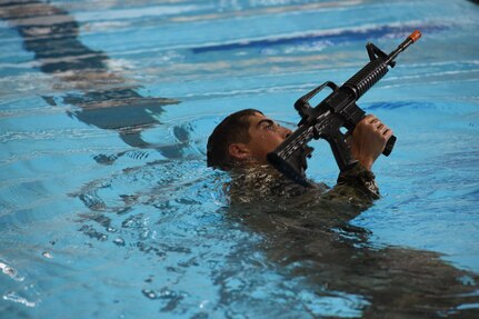 Spc. Adam Barlow, from the 65th Field Artillery Brigade, Utah National Guard, competes in the swim assessment July 21, 2021, during the U.S. Army National Guard Best Warrior Competition at Camp Navajo Military Reservation, Arizona.
