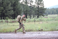Spc. Adam Barlow, from the 65th Field Artillery Brigade, Utah National Guard, competes in the16-mile, ruck-march event July 22, 2021, during the U.S. Army National Guard Best Warrior Competition at Camp Navajo Military Reservation, Arizona.