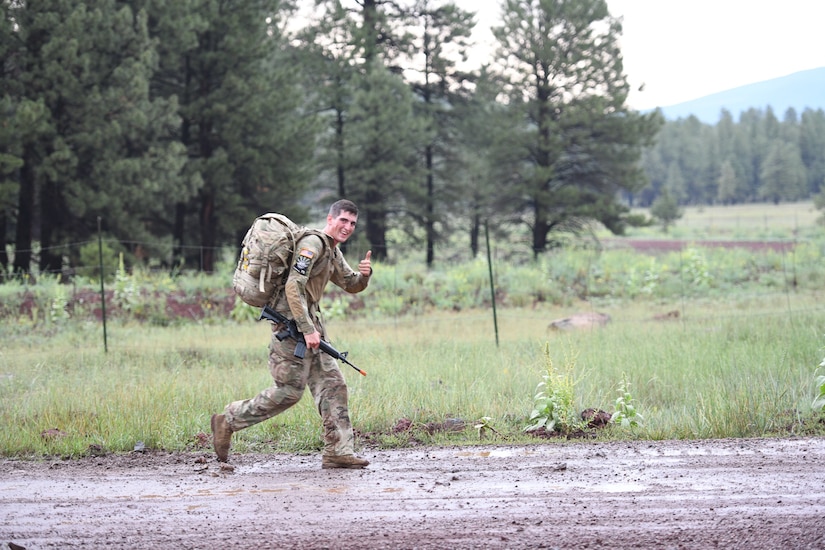 Spc. Adam Barlow, from the 65th Field Artillery Brigade, Utah National Guard, competes in the16-mile, ruck-march event July 22, 2021, during the U.S. Army National Guard Best Warrior Competition at Camp Navajo Military Reservation, Arizona.