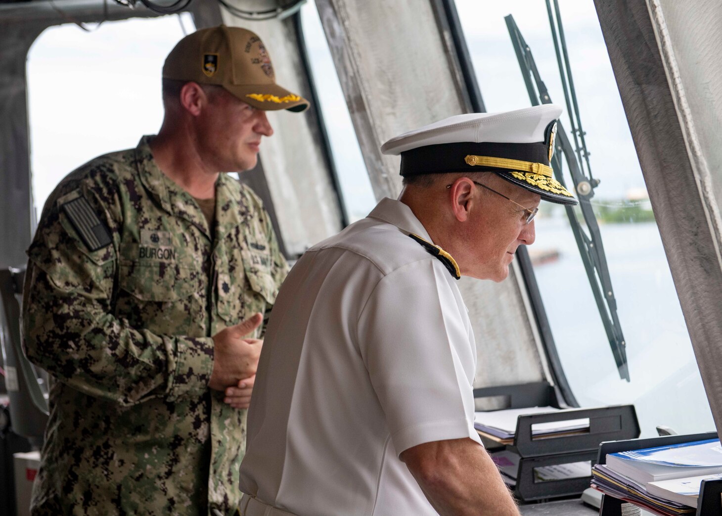 210730-N-WU807-1069 APRA HARBOR, Guam (July 30, 2021) Chief of Naval Operations (CNO) Adm. Mike Gilday, right, and Cmdr. Joseph Burgon observe the naval strike missiles (NSM) during a tour aboard Independence-variant littoral combat ship USS Charleston (LCS 18), July 30. Charleston, part of Destroyer Squadron Seven, is on a rotational deployment operating in the U.S. 7th Fleet area of operation to enhance interoperability with partners and serve as a ready-response force in support of a free and open Indo-Pacific region. (U.S. Navy photo by Mass Communication Specialist 2nd Class Adam Butler)