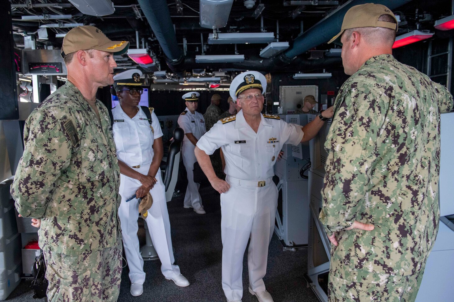 210730-N-WU807-1088 APRA HARBOR, Guam (July 30, 2021) Cmdr. Robert Holt, left, assigned to Maritime Expeditionary Security Group ONE from Commander, Task Force 75, and Cmdr. Joseph Burgon, right, give a tour to Chief of Naval Operations (CNO) Adm. Mike Gilday aboard Independence-variant littoral combat ship USS Charleston (LCS 18), July 30. Charleston, part of Destroyer Squadron Seven, is on a rotational deployment operating in the U.S. 7th Fleet area of operation to enhance interoperability with partners and serve as a ready-response force in support of a free and open Indo-Pacific region. (U.S. Navy photo by Mass Communication Specialist 2nd Class Adam Butler)