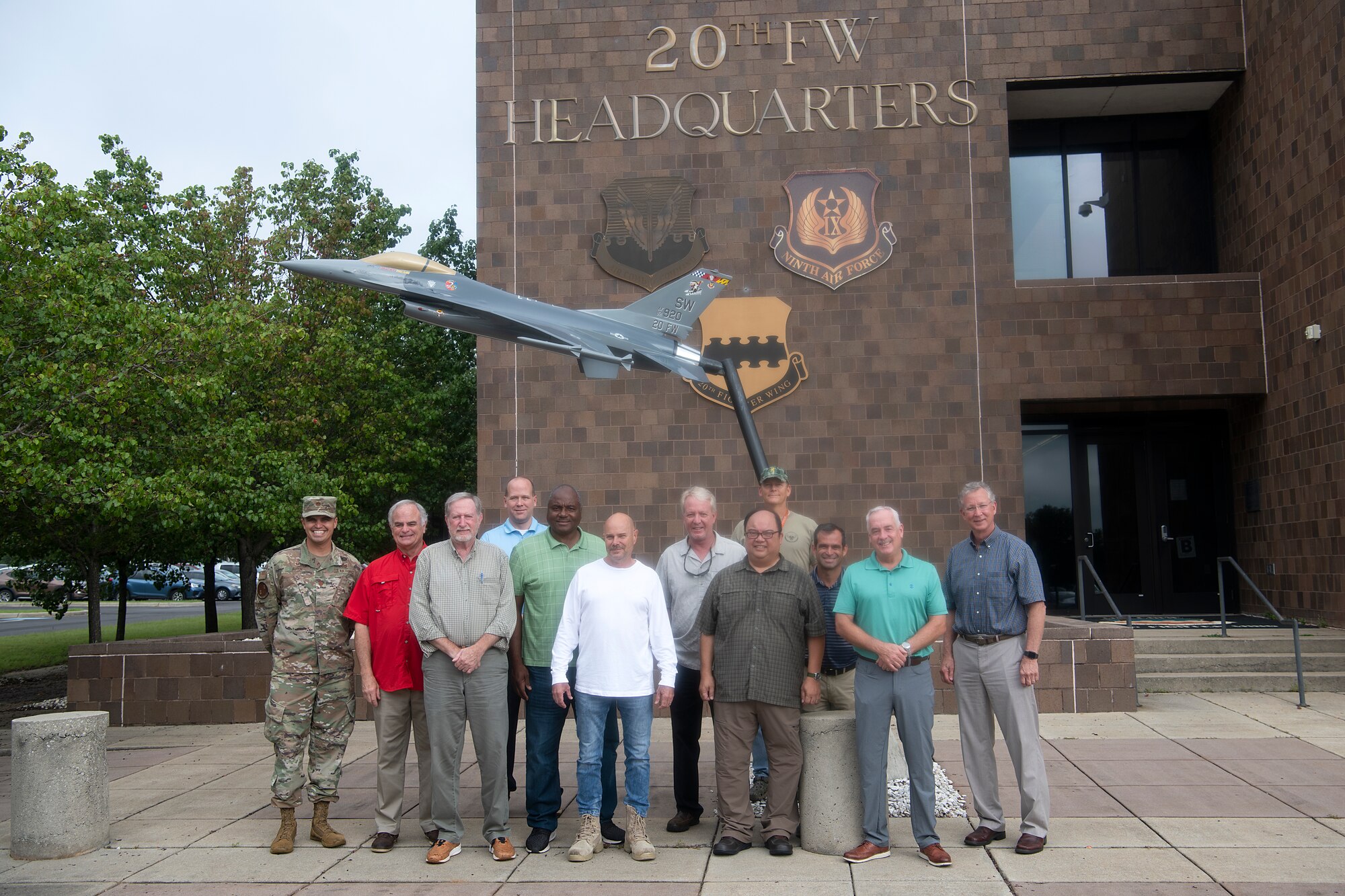 Members of the 20th Civil Engineer Squadron (CES) pose for a photo before the 20th Fighter Wing headquarters at Shaw Air Force Base, South Carolina, July 28, 2021. The 20th CES was recently awarded the Department of Defense Environmental Restoration, Installation award for initiatives put in place to protect human health and the environment. (U.S. Air Force photo by Staff Sgt. K. Tucker Owen)