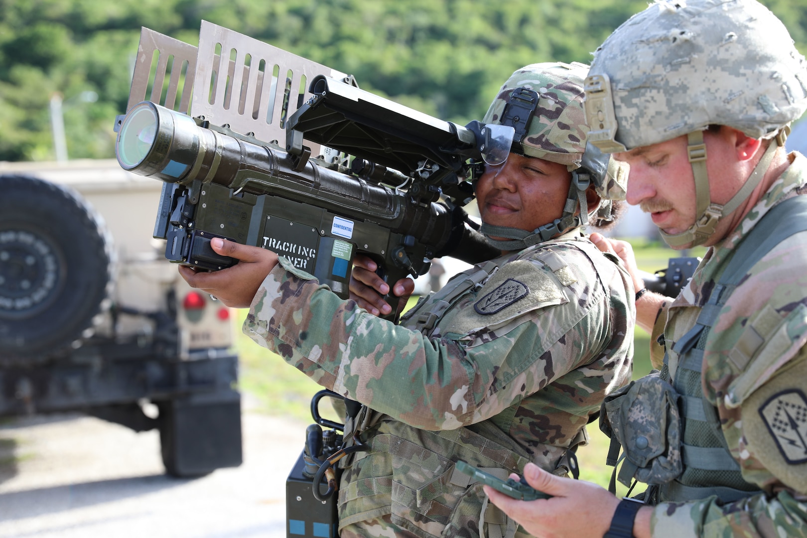 Ohio National Guard's Spc. Kiya Marshall and Staff Sgt. Tyler Hamilton, assigned to Alpha Battery, 1st Battalion, 174th Air Defense Artillery Regiment, operate a man-portable air-defense system to engage an enemy aircraft during exercise Forager 21 July 30, 2021, at Andersen Air Force Base, Guam. The Avenger is a self-propelled surface-to-air missile system that provides mobile, short-range air defense protection for ground units.