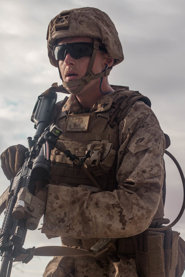 A Marine with Fox Company, 2nd Battalion, 23rd Marines, 4th Marine Division, maneuvers through terrain on Range 410A during Integrated Training Exercise (ITX) 4-21 at Marine Corps Air Ground Combat Center, Twentynine Palms, California on July 31, 2021. Range 410A provides Reserve Marines the opportunity to execute a fire and maneuver attack supported by mortarmen, machine gunners and combat engineers. (U.S Marine Corps photo by Lance Cpl. David Intriago)