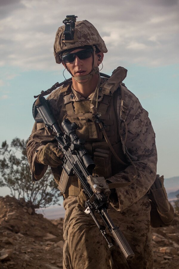 A Marine with Fox Company, 2nd Battalion, 23rd Marines, 4th Marine Division, rushes enemy targets on Range 410A during Integrated Training Exercise (ITX) 4-21 at Marine Corps Air Ground Combat Center, Twentynine Palms, California on July 31st, 2021. Range 410A provides Reserve Marines the opportunity to execute a fire and maneuver attack supported by mortarmen, machine gunners and combat engineers. (U.S Marine Corps photo by Lance Cpl. David Intriago)