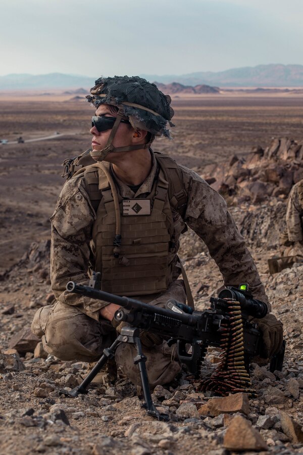 Lance Cpl. Brian Cruz, a machine gunner with Echo Company, 2nd Battalion, 23rd Marines, awaits orders on Range 410A during Integrated Training Exercise (ITX) 4-21 at Marine Corps Air Ground Combat Center, Twentynine Palms, California on July 30th, 2021. Range 410A provides Reserve Marines the opportunity to execute a fire and maneuver attack supported by mortarmen, machine gunners and combat engineers. (U.S Marine Corps photo by Lance Cpl. David Intriago)