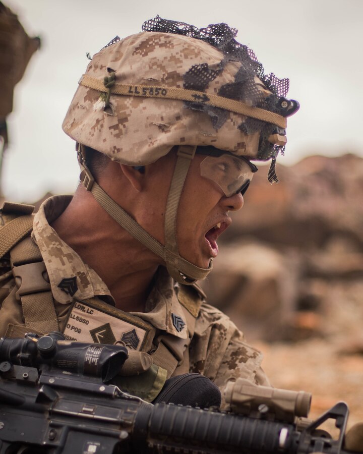 Sgt. Lucas Low, a squad leader with Echo Company, 2nd Battalion, 23rd Marines, gives commands to his squad on Range 410A during Integrated Training Exercise (ITX) 4-21 at Marine Corps Air Ground Combat Center, Twentynine Palms, California on July 30th, 2021. Range 410A provides Reserve Marines the opportunity to execute a fire and maneuver attack supported by mortarmen, machine gunners and combat engineers. (U.S Marine Corps photo by Lance Cpl. David Intriago)