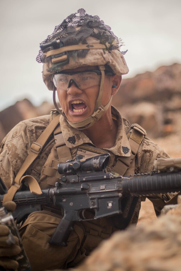 Sgt. Lucas Low, a squad leader with Echo Company, 2nd Battalion, 23rd Marines, gives commands to his squad on Range 410A during Integrated Training Exercise (ITX) 4-21 at Marine Corps Air Ground Combat Center, Twentynine Palms, California on July 30th, 2021. Range 410A provides Reserve Marines the opportunity to execute a fire and maneuver attack supported by mortarmen, machine gunners and combat engineers. (U.S Marine Corps photo by Lance Cpl. David Intriago)