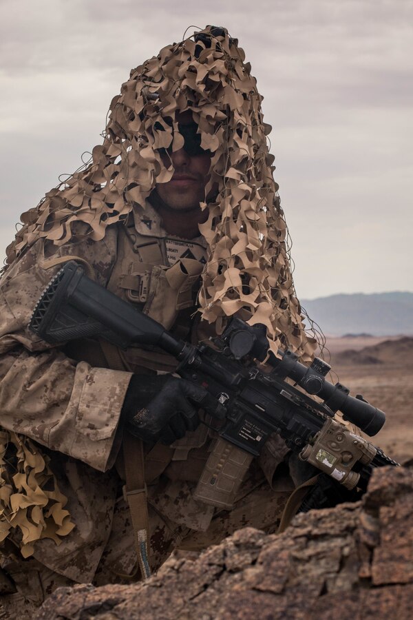 Lance Cpl. Louis Watterssmith, a designated marksman with Echo Company, 2nd Battalion, 23rd Marines, prepares to provide covering fire on Range 410A during Integrated Training Exercise (ITX) 4-21 at Marine Corps Air Ground Combat Center, Twentynine Palms, California on July 30th, 2021. Range 410A provides Reserve Marines the opportunity to execute a fire and maneuver attack supported by mortarmen, machine gunners and combat engineers. (U.S Marine Corps photo by Lance Cpl. David Intriago)