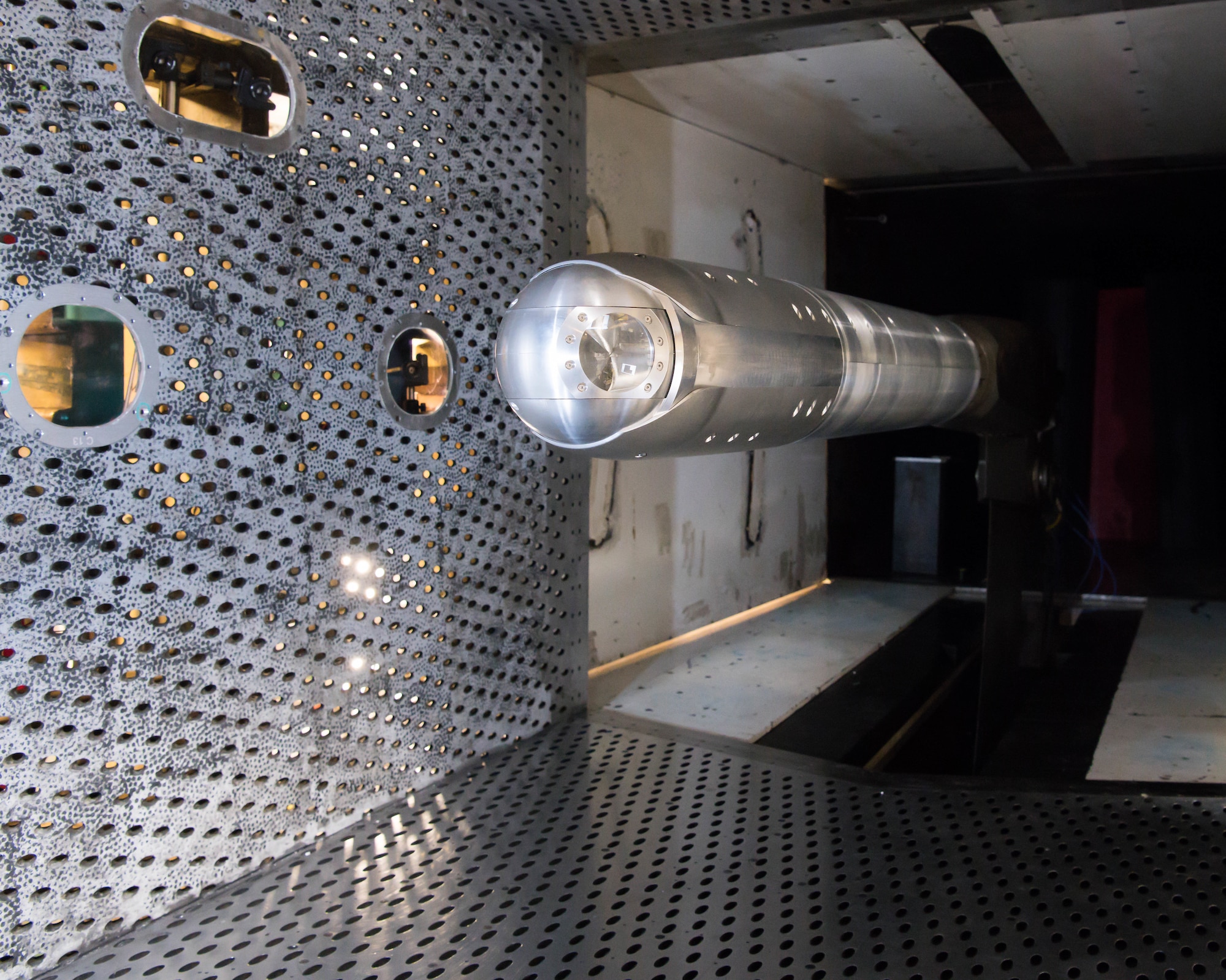 A directed energy (DE) system turret is positioned on a sting in the 4-foot transonic wind tunnel at Arnold Air Force Base for testing by the Aerodynamics Test Branch of Arnold Engineering Development Complex, March 5, 2021. Wind tunnel testing allows system developers to see the impact of airflow disturbances on the DE beam. (U.S. Air Force photo by Jill Pickett)