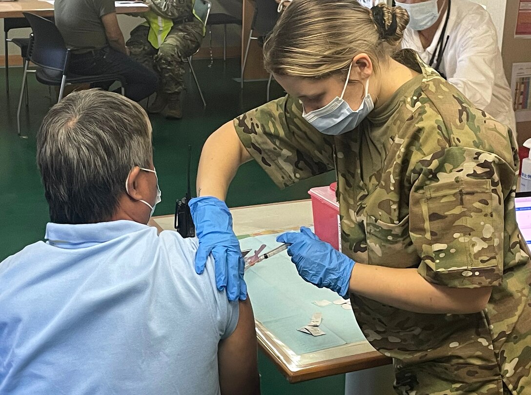 Virginia National Guard Soldiers conduct a mobile vaccination mission on board international ships in July 2021 in Norfolk, Virginia.