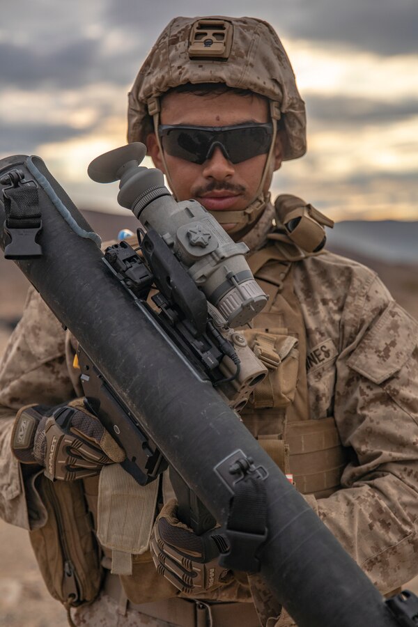 Lance Cpl. Lucas Ashton, an assistant gunner with Fox Company, 2nd Battalion, 23rd Marines, poses for a photo on Range 410A during Integrated Training Exercise (ITX) 4-21 at Marine Corps Air Ground Combat Center, Twentynine Palms, California on July 30th, 2021. Reserve Marines and Sailors have come together from across the country as an integrated Marine Air-Ground Task Force to take part in a live-fire, combined arms exercise that will better prepare Marine Forces Reserve in its mission to augment and reinforce the Active Component. (U.S. Marine Corps photo by Sgt. JVonnta Taylor)