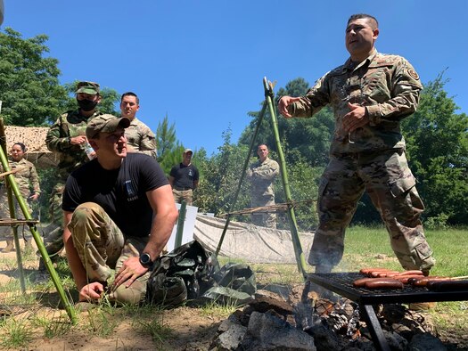 Air Force technical sergeant translates at a survival briefing.