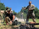 Air Force technical sergeant translates at a survival briefing.