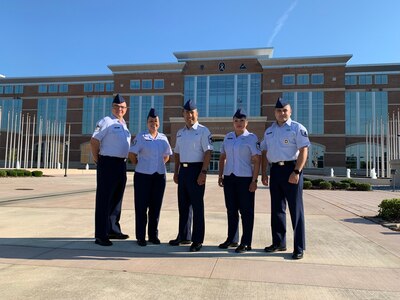 Five NCOs from IAAFA pose for group photo.