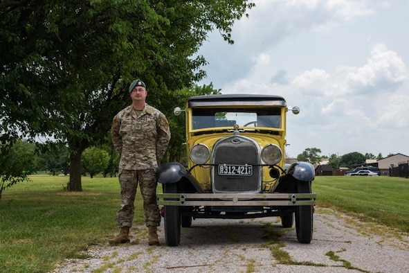 Tech. Sgt. Joshua Schmitz, 22nd Operational Support Squadron survival evasion resistance escape specialist, poses with his 1929 Ford Model A July 20, 2021, at McConnell Air Force Base, Kansas. Schmitz encourages Airmen to find hobbies outside of their career fields to help decompress from the demands of the mission. (U.S. Air Force photo by Airman 1st Class Zachary Willis)