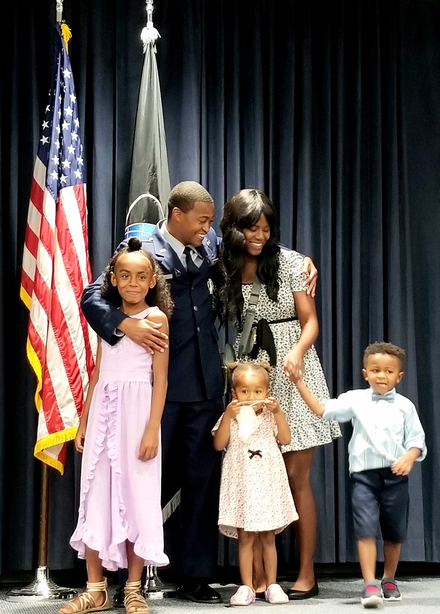 Just commissioned U.S. Space Force officer Maj. Derick Perry shares the moment with his wife Melissa and children. Perry was one of 10 Air Force Research Laboratory and Space and Missile Systems Center officers inducted into the Space Force in a ceremony held at Kirtland AFB, N.M. July 23. (U.S. Air Force photo/Joanne Perkins/AFRL)