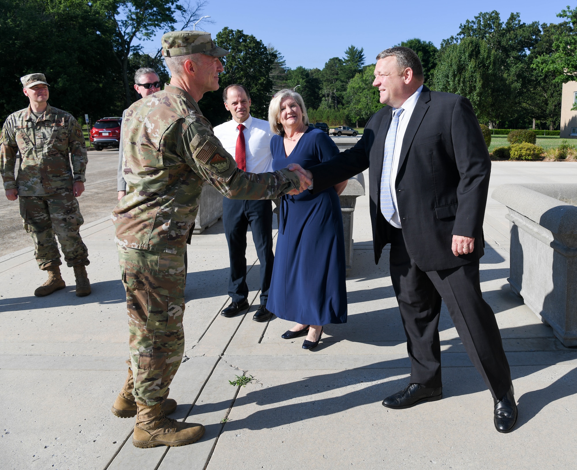 Maj. Gen. Christopher Azzano, commander, Air Force Test Center, is greeted by Brian Stacy, action officer, and AEDC leadership upon his arrival at Arnold Air Force Base, Tenn., June 30, 2021. (U.S. Air Force photo by Jill Pickett)