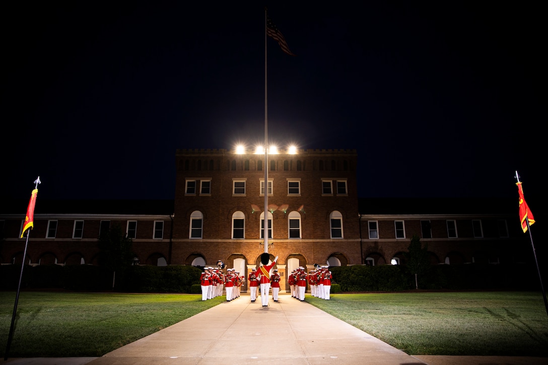 “The President’s Own,” U.S. Marine Band, performs during the Friday Evening Parade at Marine Barracks Washington, July 30, 2021.
