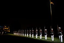 Marines with the Silent Drill Platoon execute their “long line” sequence during the Friday Evening Parade at Marine Barracks Washington, July 30, 2021.